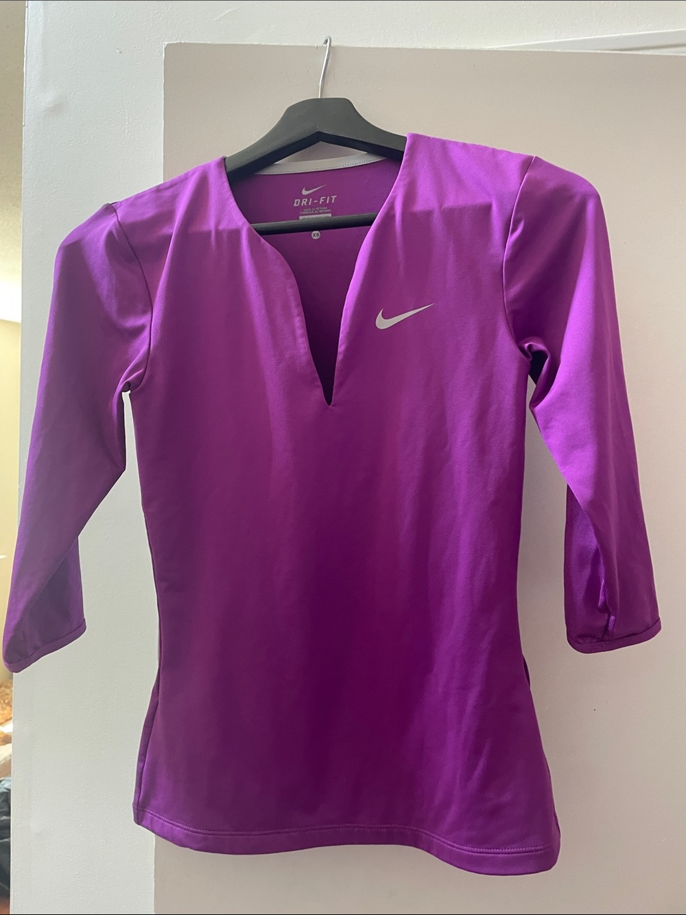 Nike Women’s V-Neck Long Sleeve Dri-FIT Top in Magenta
